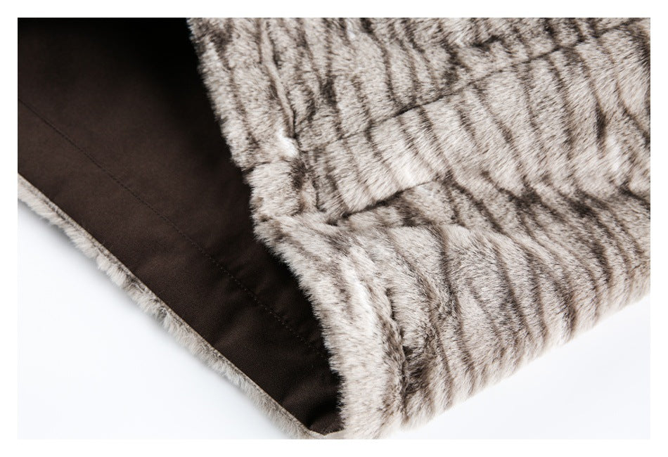 Close-up showing the dark brown lining inside the edge of a striped fur garment.