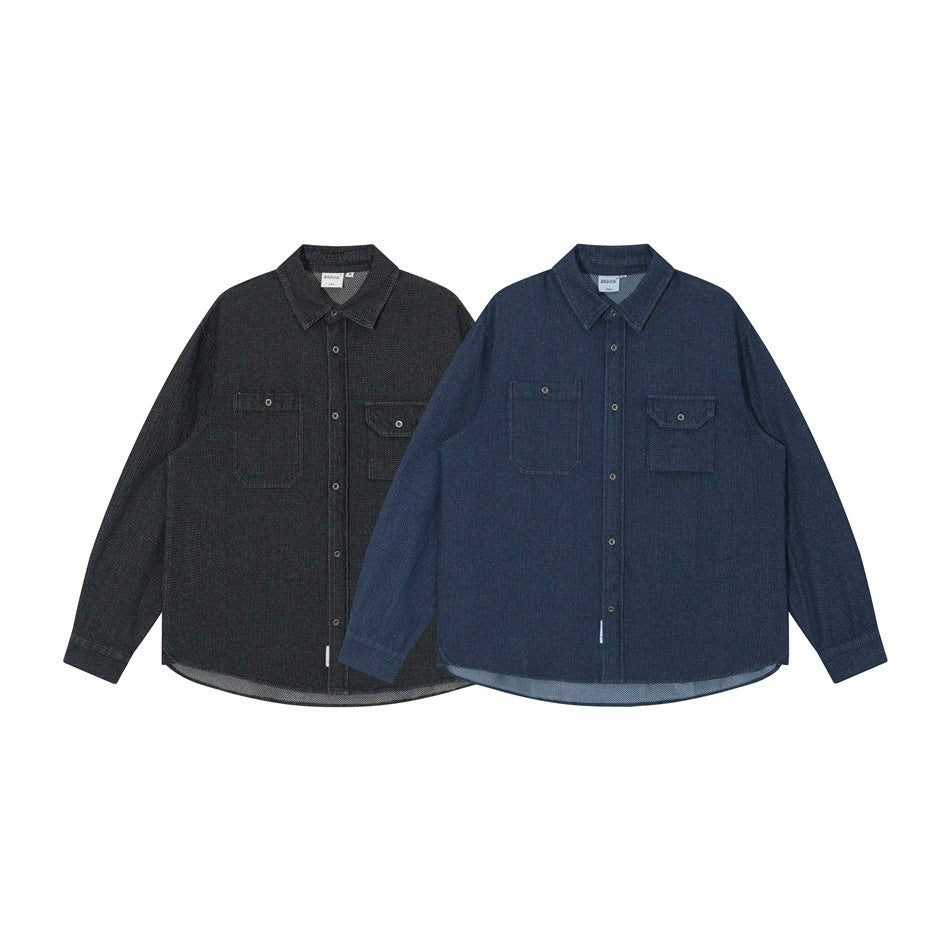 Two long-sleeve button-up shirts shown from the front, one charcoal and one dark blue, each with two chest pockets.