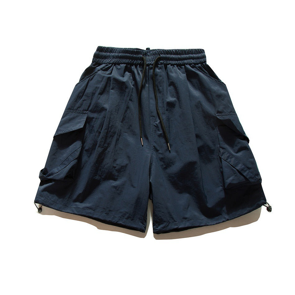 Navy cargo shorts front view with black drawstring, side flap pockets and hem toggle cords
