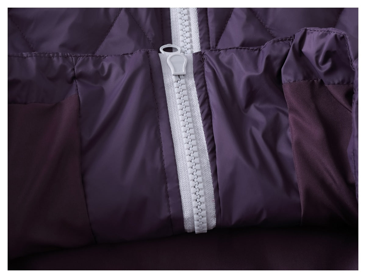 Close-up of the light gray front zipper and pocket areas on a dark purple garment.