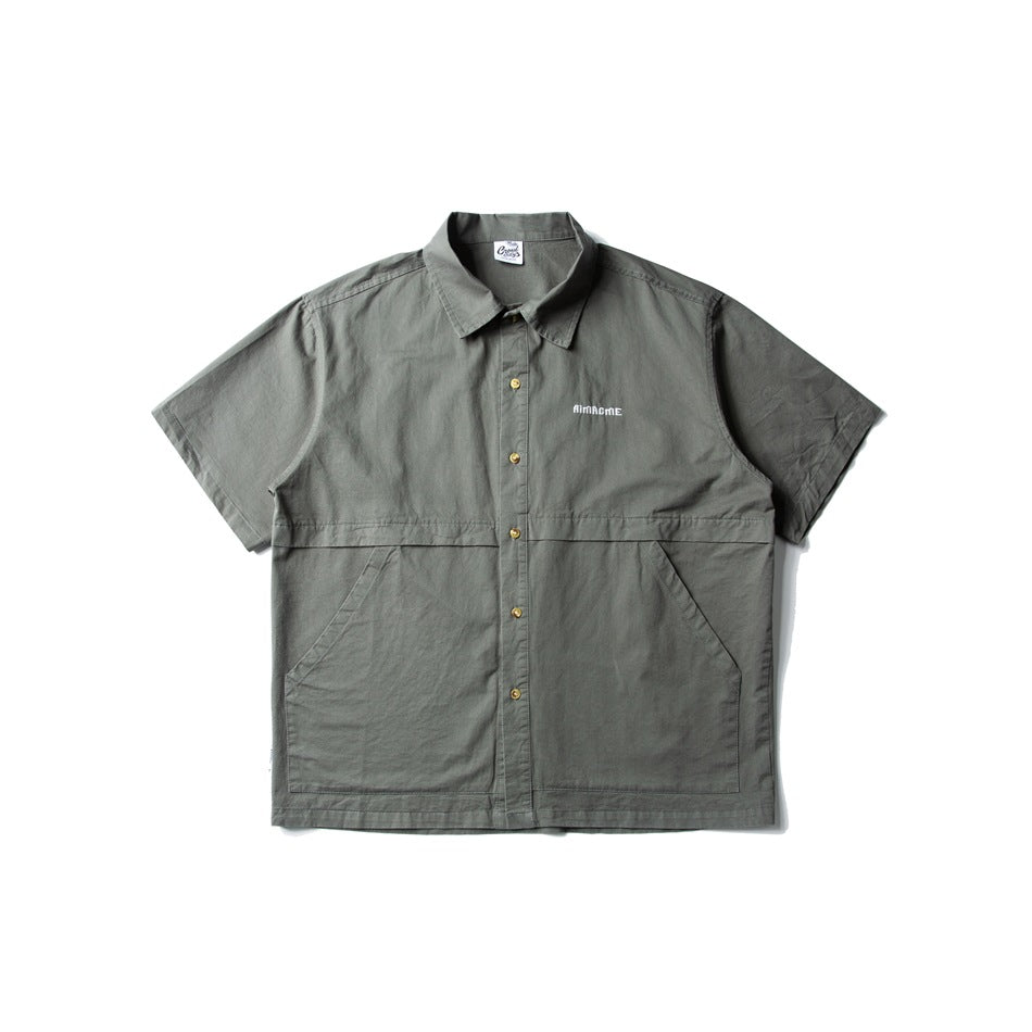 Gray green short-sleeve button-up shirt, front flat lay, with slanted pockets and gold-tone buttons