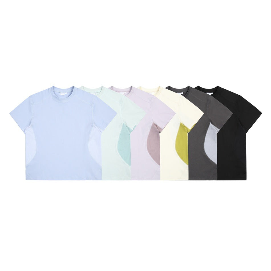 Six short-sleeve crew-neck T-shirts displayed together in pale blue, mint, lavender, cream, charcoal, and black.