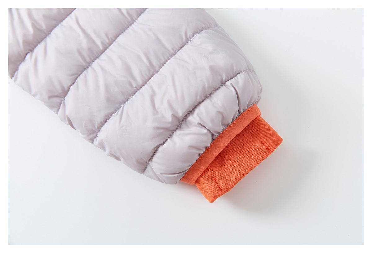 Close-up of a pale lavender quilted sleeve with a wide orange ribbed cuff.