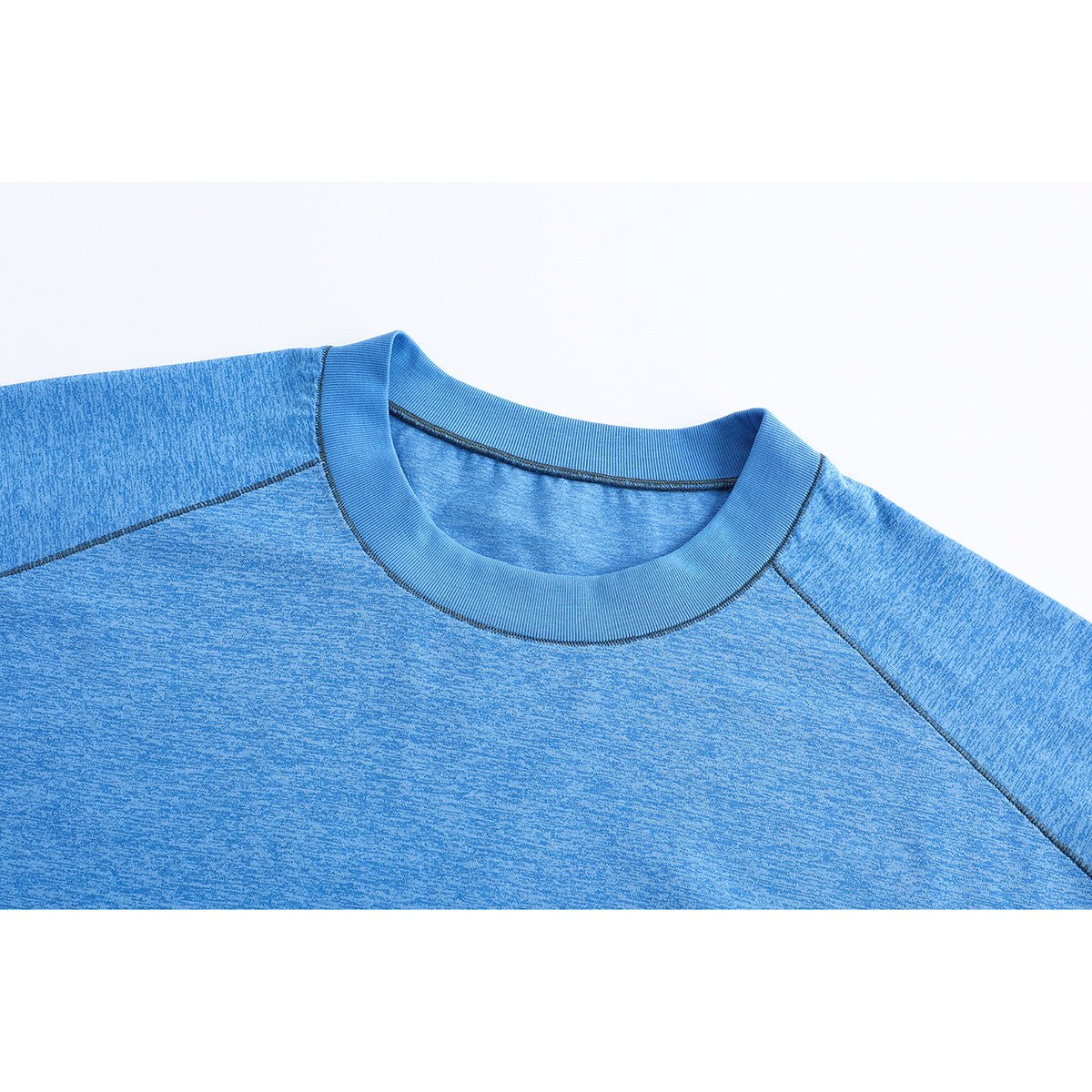 Close-up of a heathered blue crew-neck T-shirt collar and raglan shoulder seams.