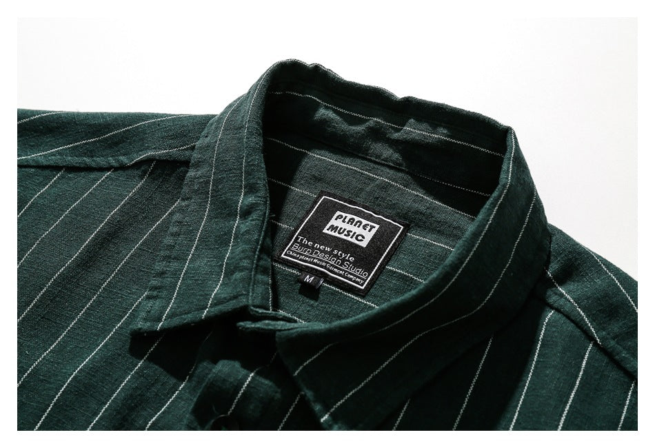 Close-up of the dark green striped shirt's collar and sewn-in neck label.