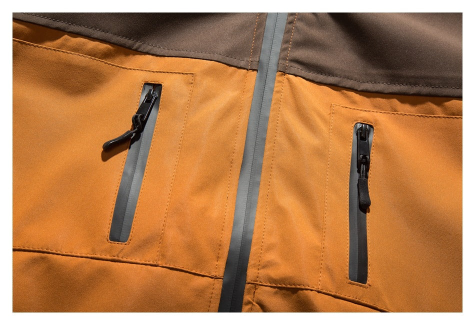 Close-up of the jacket's two vertical zip pockets and central zipper, with a dark brown upper panel.