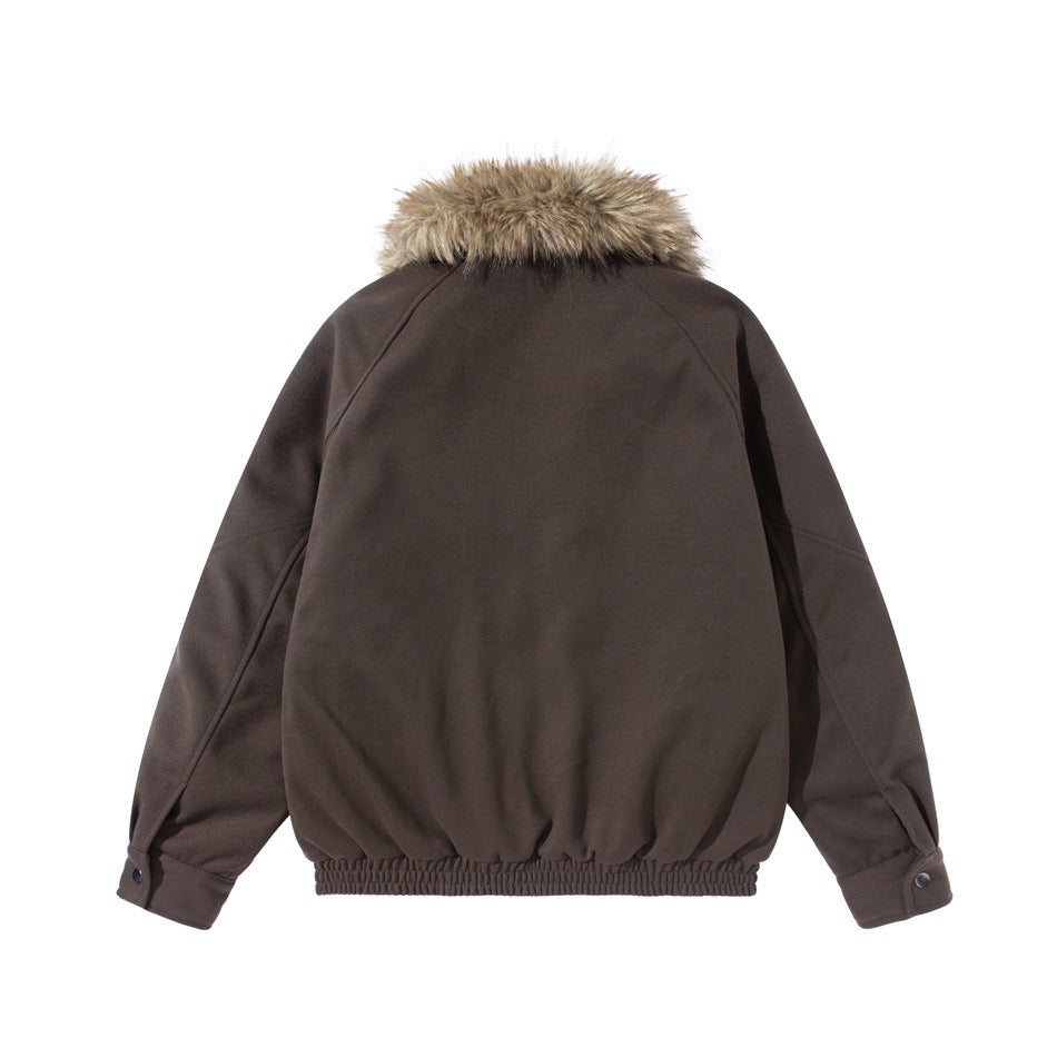 Back view of a dark brown jacket with raglan sleeves, snap cuffs, a gathered hem, and a tan fur collar.