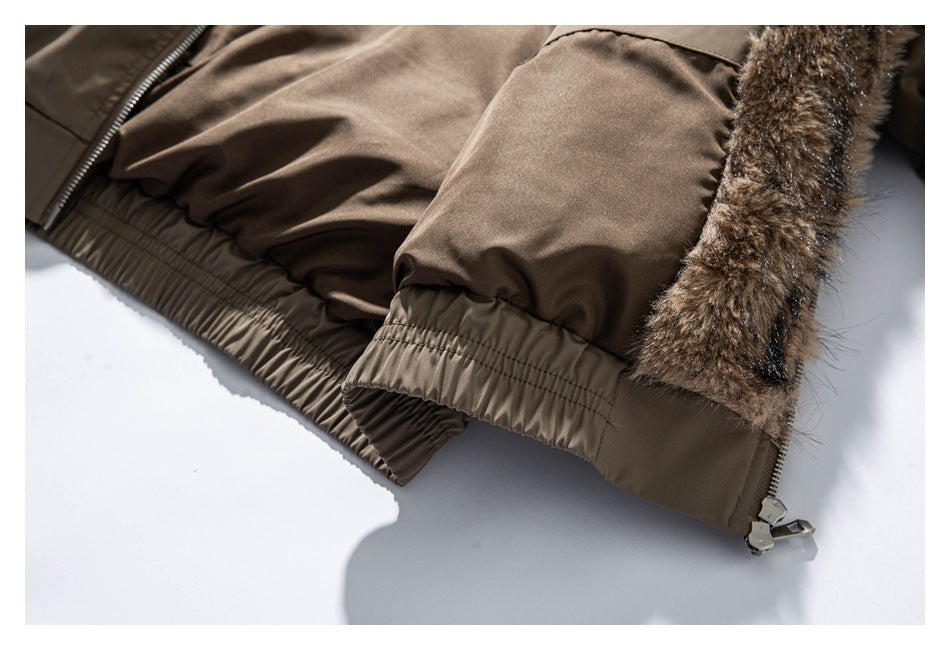 Close-up of the taupe jacket's gathered sleeve cuff, hem, zipper, and brown faux-fur trim.