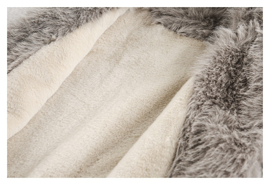 Close-up of the jacket's plush cream interior bordered by shaggy gray-brown trim.