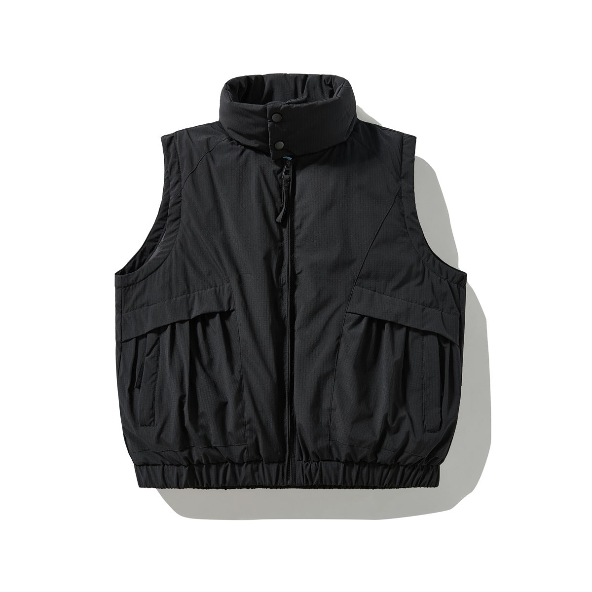 Black sleeveless padded vest with stand collar, front zip, flap pockets and elastic hem, flat lay