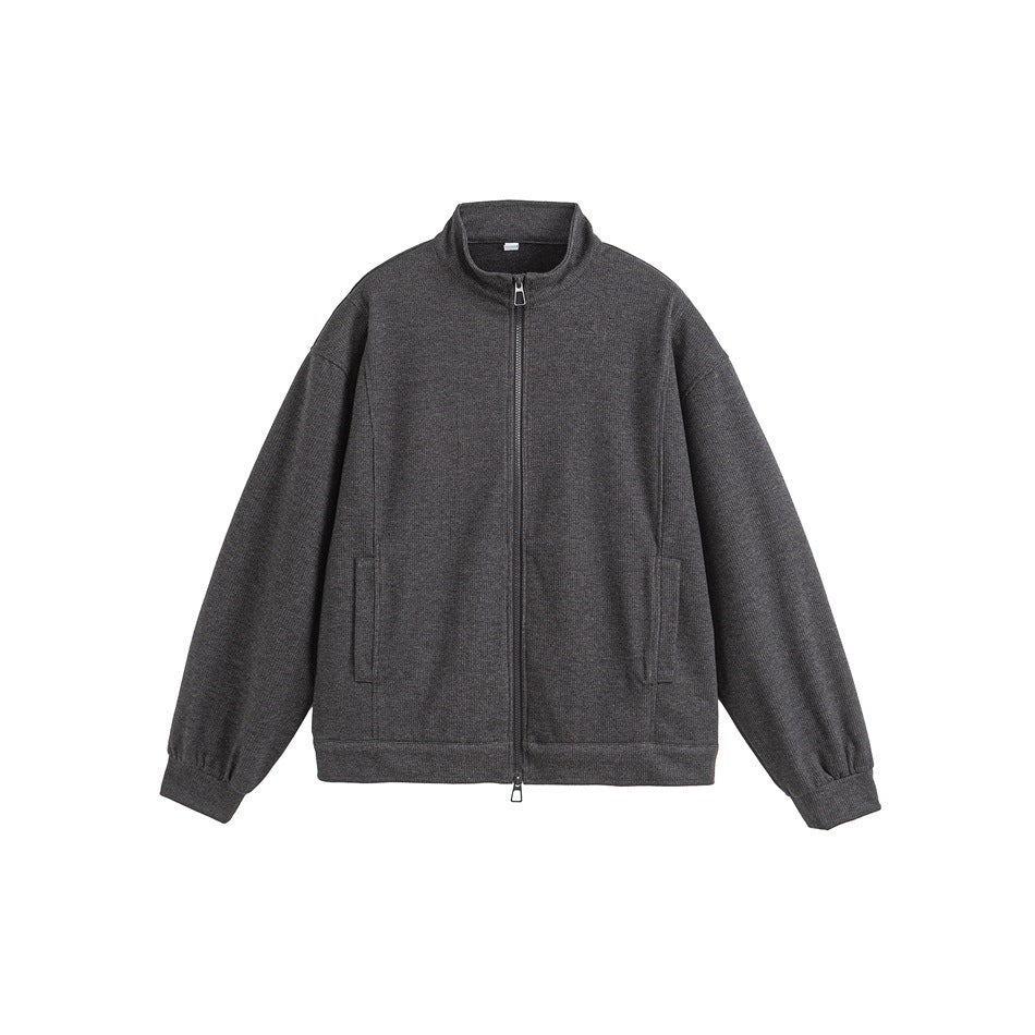 Dark gray stand-collar zip jacket flat lay with side pockets and ribbed cuffs