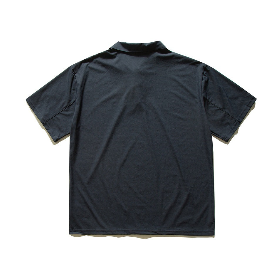 Back view of dark navy short-sleeve polo shirt flat lay, plain back with sleeve seams