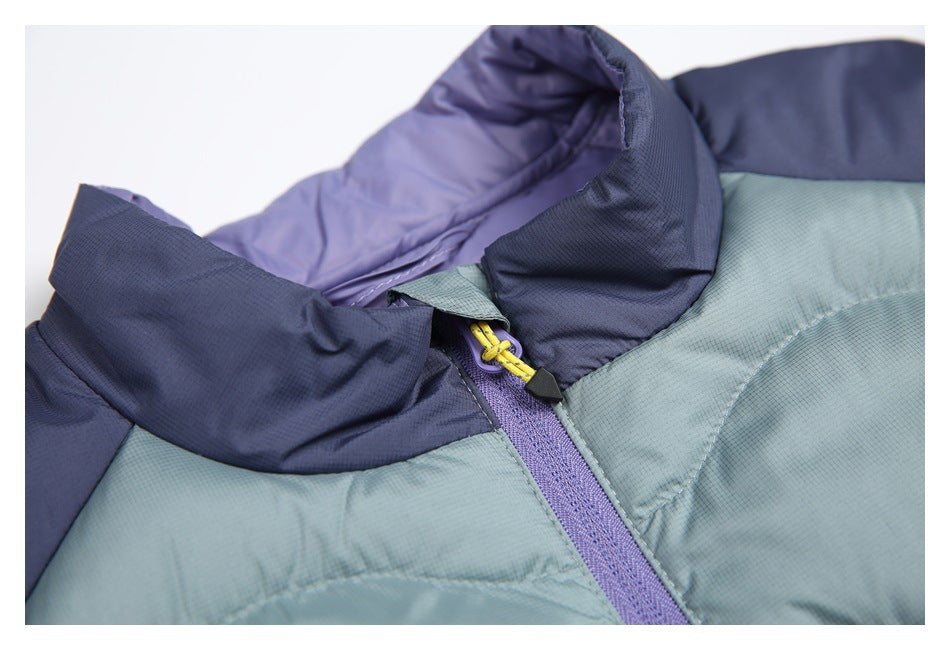 Close-up of the vest's raised navy collar, purple zipper, and yellow zipper pull.