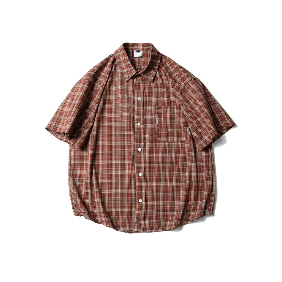 Red-brown plaid short-sleeve button-up shirt with chest pocket, flat front view