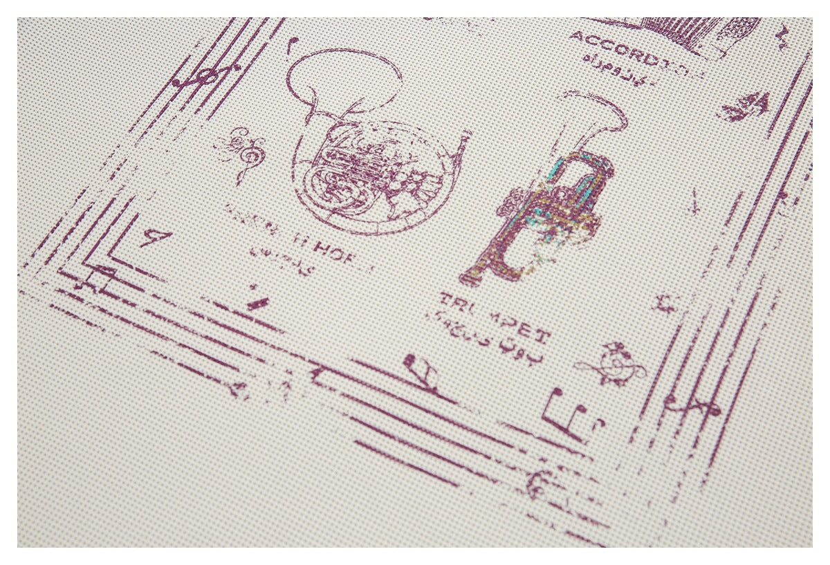 Angled close-up of an off-white shirt's burgundy graphic, featuring music-themed illustrations and small text.
