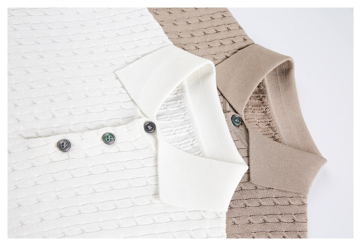 Close-up of ivory and taupe knit polo shirts showing their collars, buttons, and textured stitch pattern.