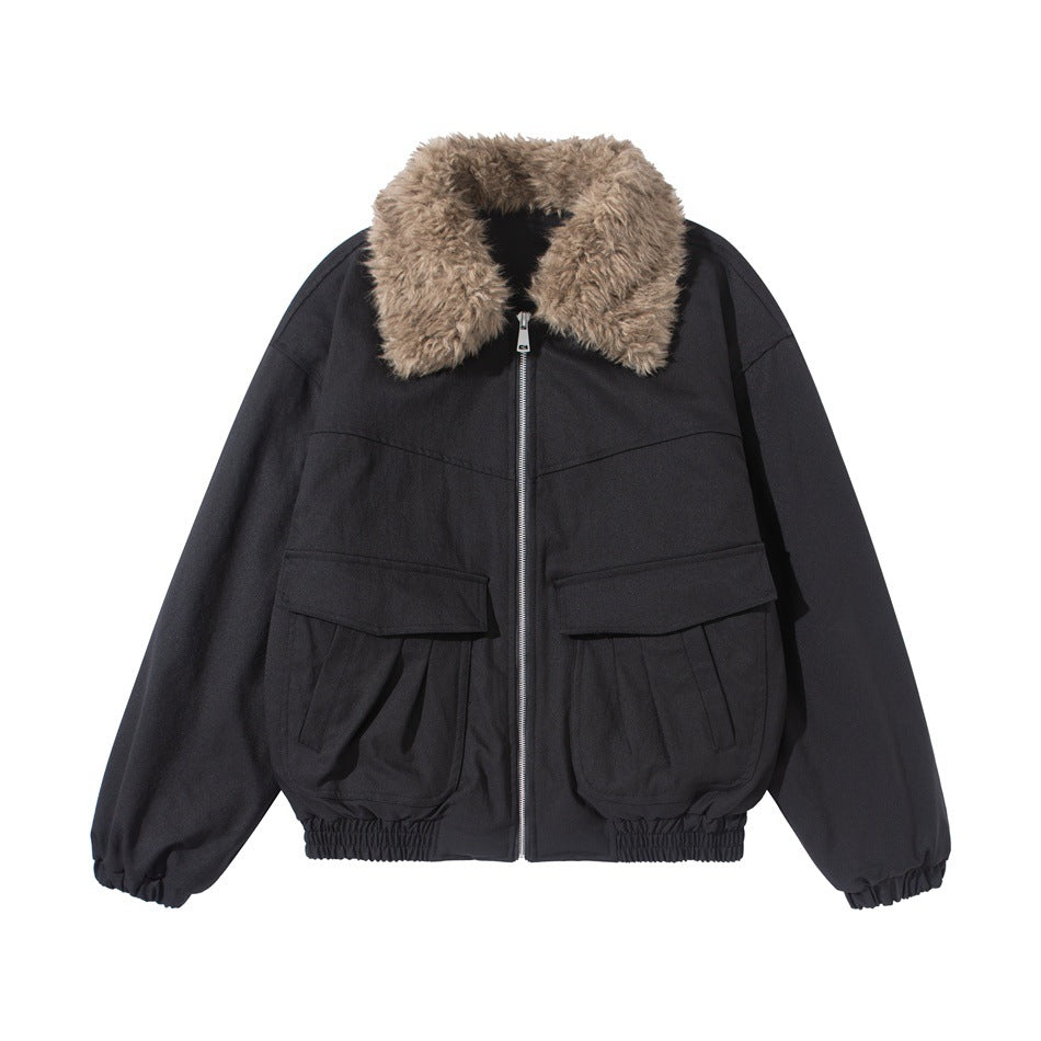 Black zip-front jacket with fluffy brown fleece-like collar, large flap pockets and elastic cuffs and hem, flat lay