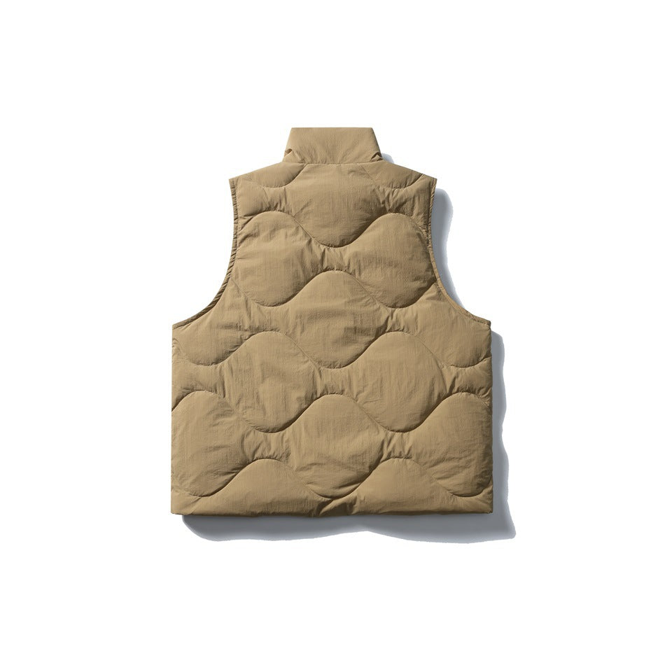 Back view of a tan sleeveless quilted vest with a high collar and wavy stitched panels.