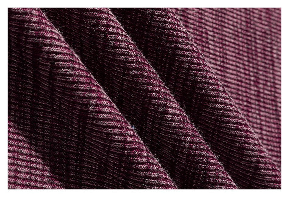 Macro view of the burgundy shirt's heathered knit texture and folds.