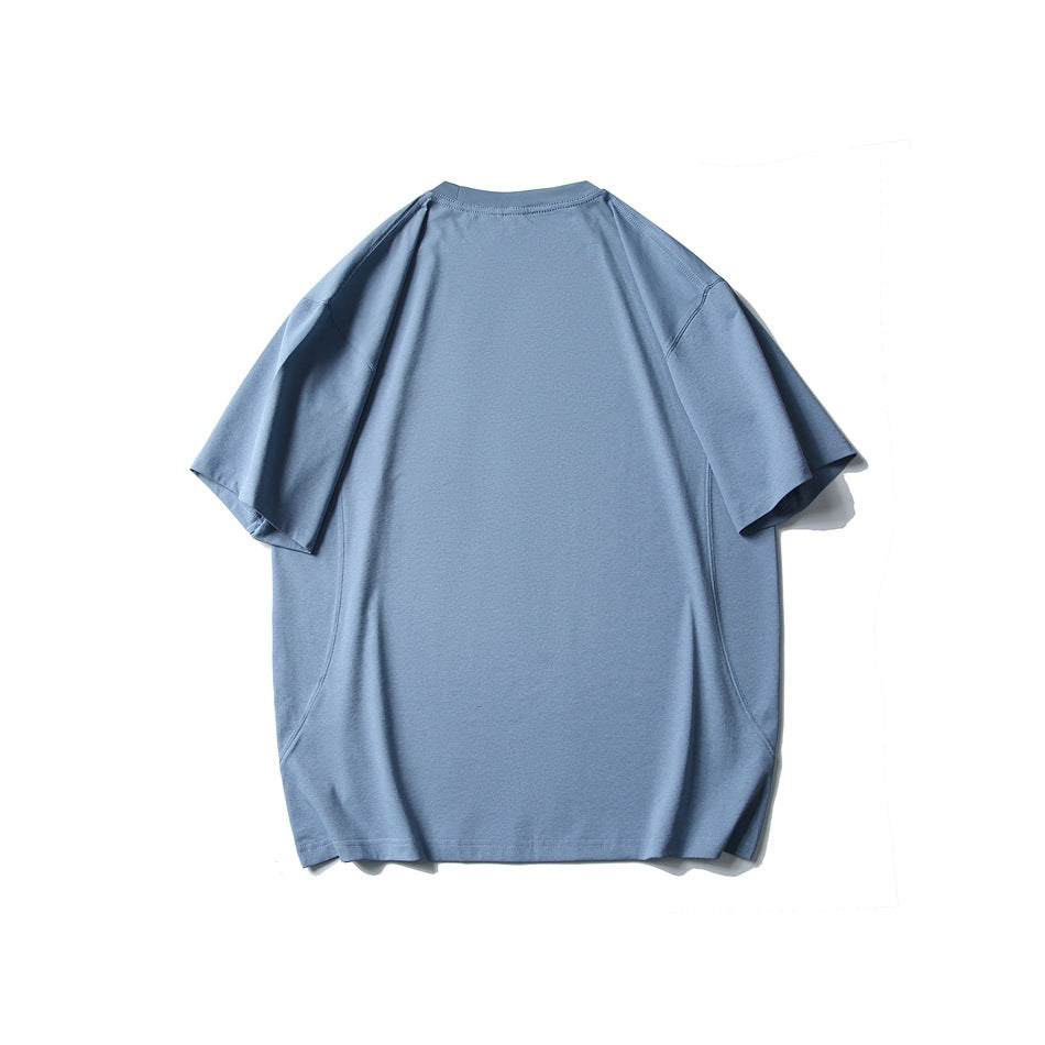 Plain dusty blue oversized short-sleeve crew-neck T-shirt, shown from the back against a white background.
