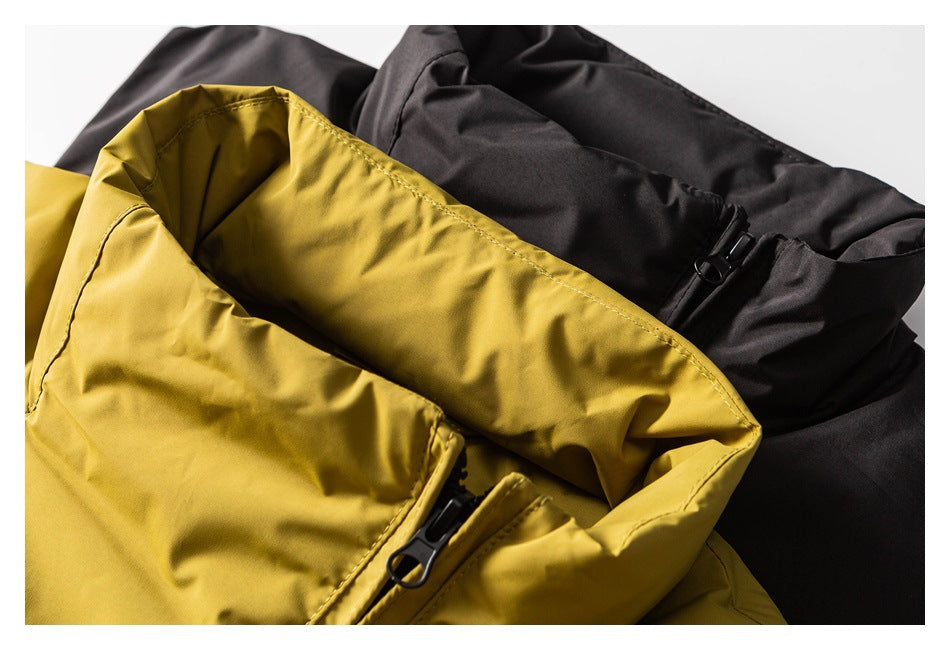 Close-up of mustard yellow and black jackets, showing collars and black zipper hardware.