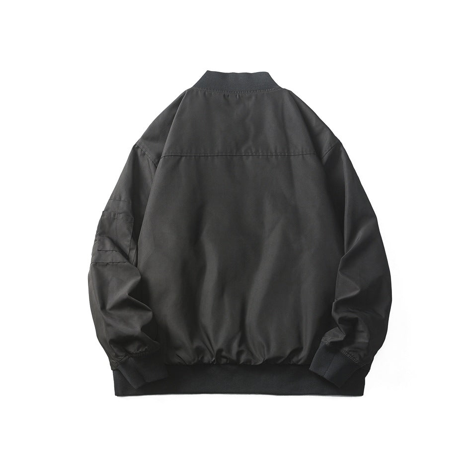 Back view of a black bomber jacket laid flat, with a ribbed collar, cuffs and hem.