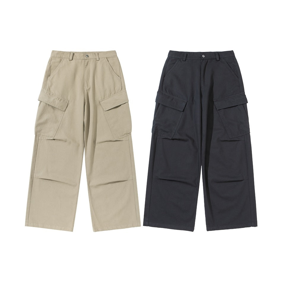 Two pairs of wide-leg cargo pants shown from the front: one beige and one dark charcoal, both with large flap pockets.
