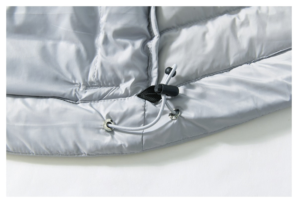 Close-up of the light gray jacket hem with an adjustable elastic drawcord, eyelets, and toggle.