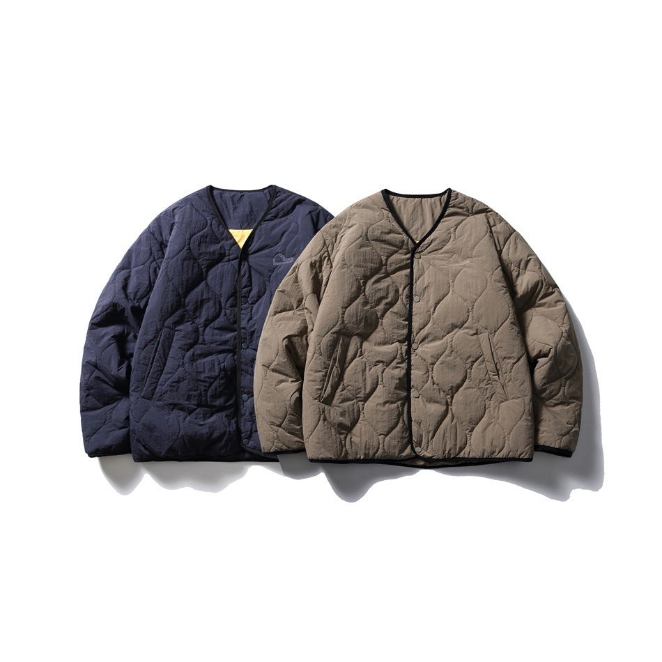 Two quilted jackets shown together: one navy and one taupe, both with V-necks, snap fronts and black trim.