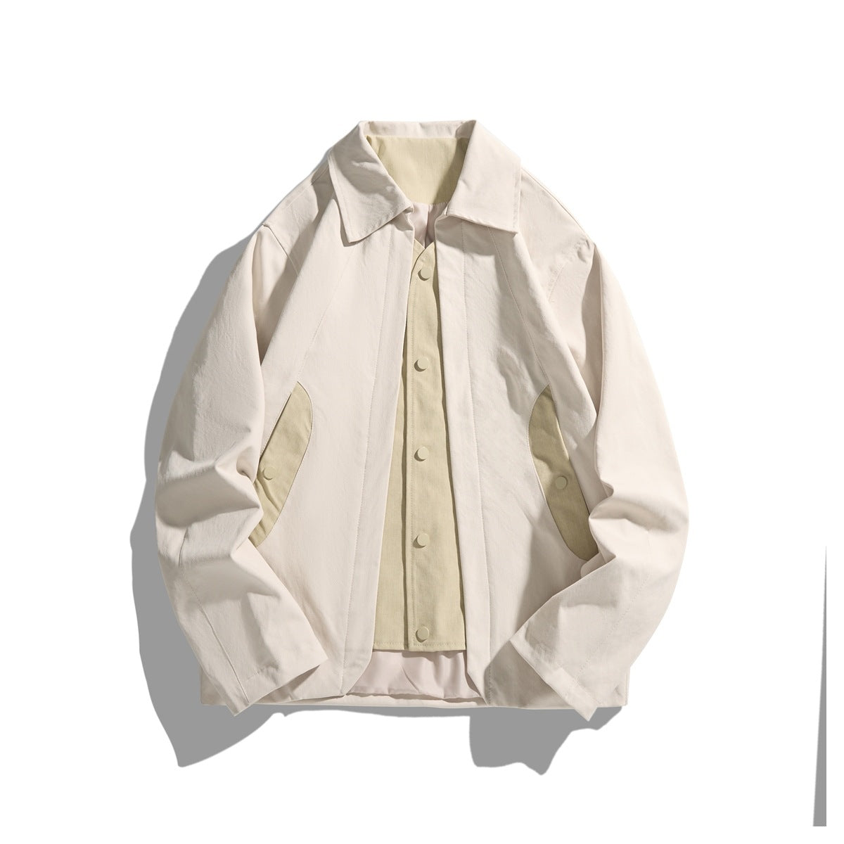 Apricot beige collared jacket flat lay with layered snap-front vest panel and curved side contrast panels