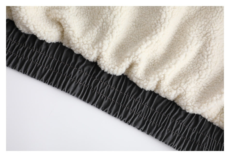 Close-up of cream fleece lining beside a black gathered elastic edge.