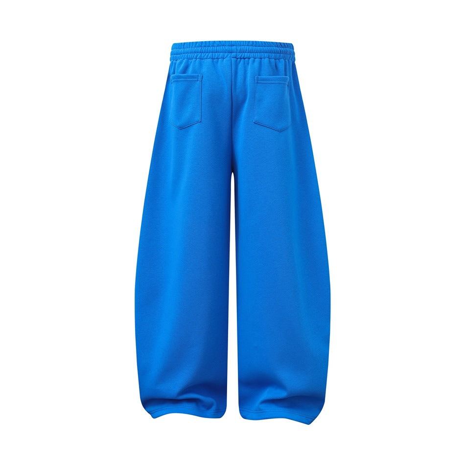Back view of bright blue wide-leg pants with an elastic waistband and two rear pockets, shown flat.