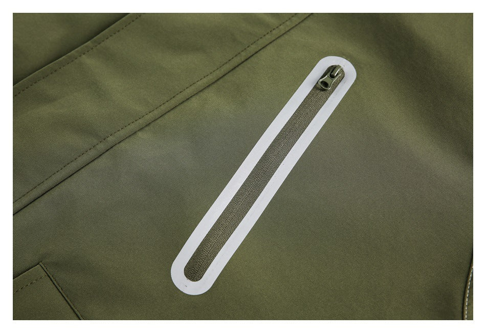 Close-up of an olive jacket's long zipper with a white border and a small metal pull.