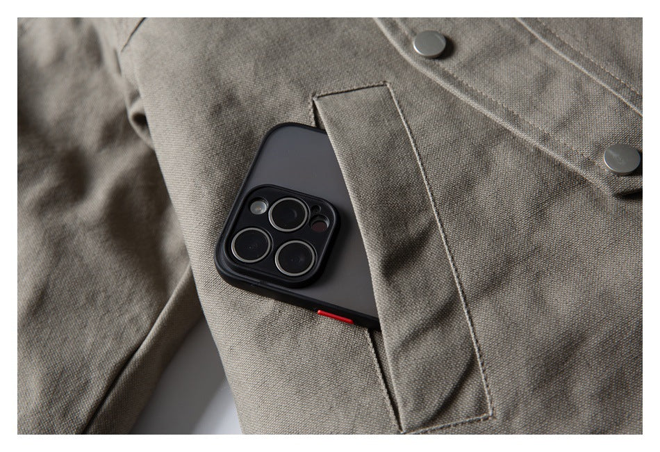 Close-up of a taupe jacket pocket holding a smartphone, with snap buttons nearby.