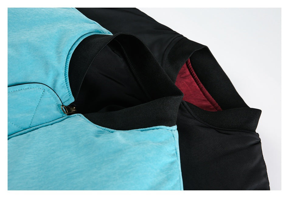 Close-up of black ribbed jacket collars and burgundy lining beside a turquoise jacket panel.