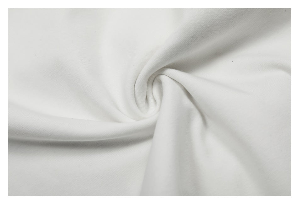 Close-up of plain white garment fabric draped into a twist.