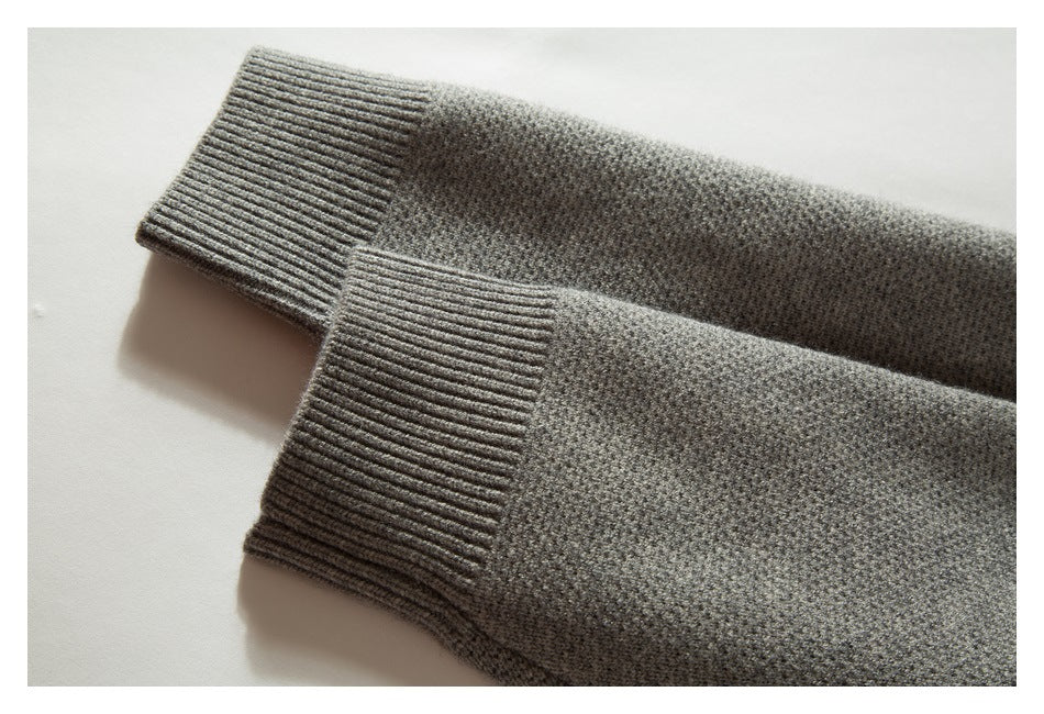 Close-up of the gray cardigan's ribbed cuffs and textured knit sleeves.