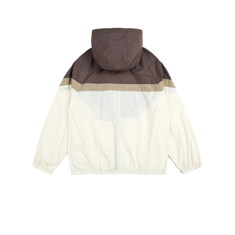 Back view of a hooded jacket with a brown upper panel, tan stripe, and cream body and sleeves.