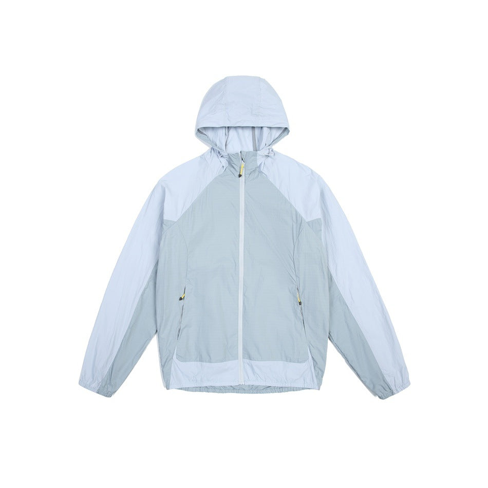 Blue color-block hooded zip jacket flat lay, front view, with light blue and gray-blue panels and yellow zipper pulls