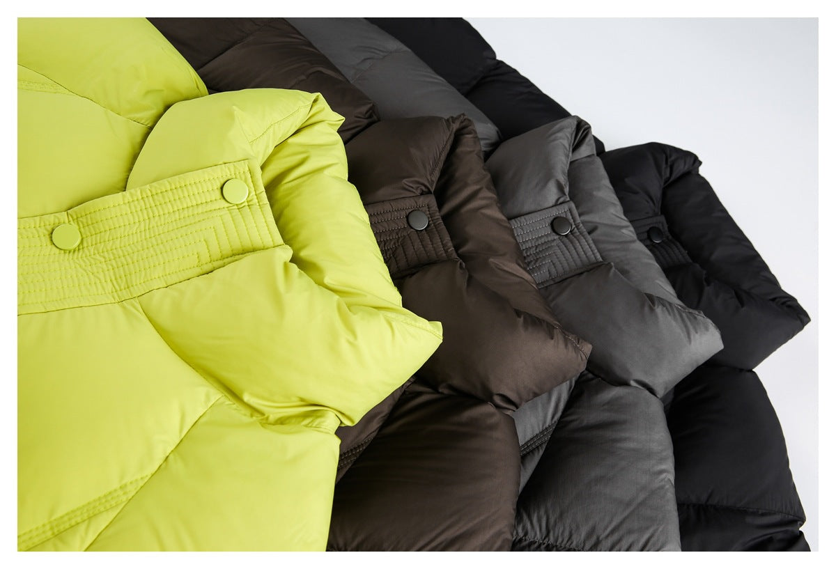 Close-up of puffer jackets in lime green, brown, gray, and black, showing quilted sleeves and snap-tab details.