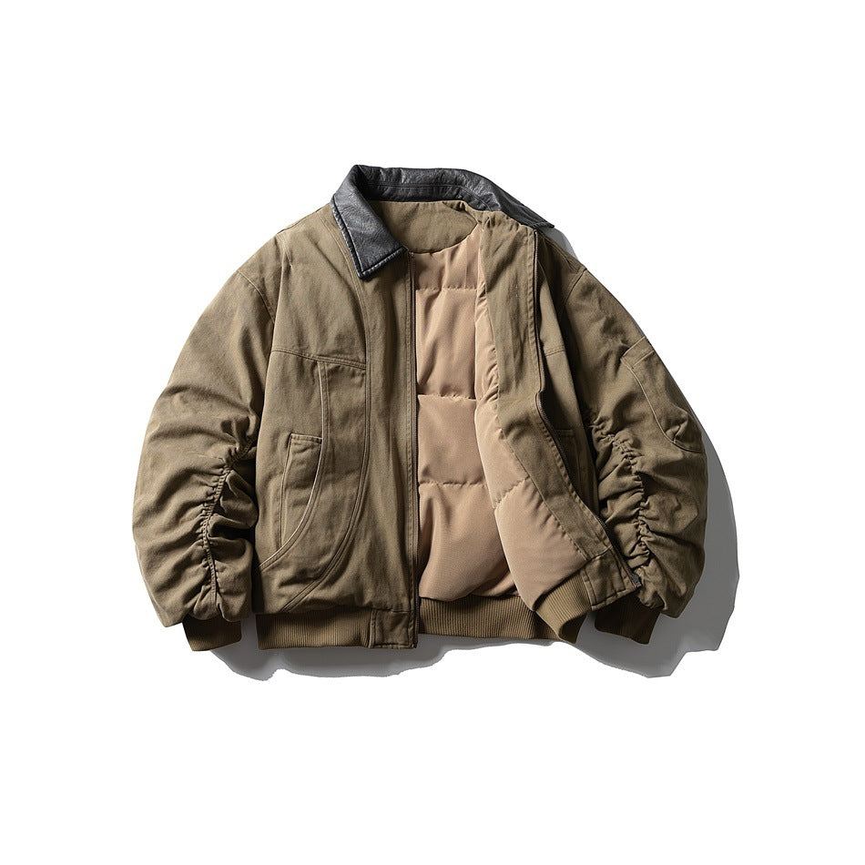 Front view of an open olive-brown jacket with a dark collar, tan lining, and gathered sleeves.