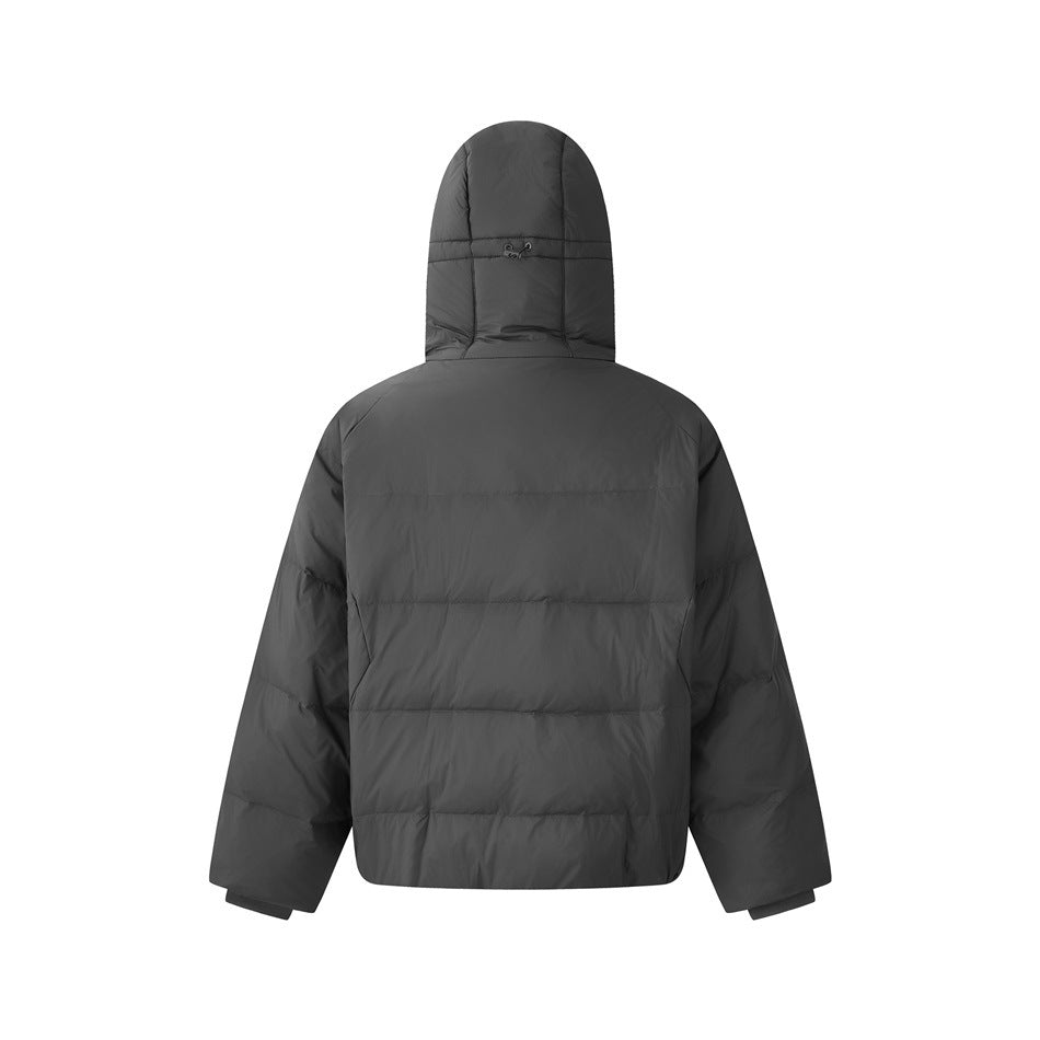 Back view of a charcoal gray quilted puffer jacket with an attached hood and long sleeves on white.