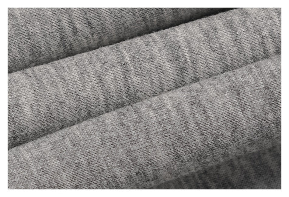 Extreme close-up of heather gray knit fabric showing its textured loops.