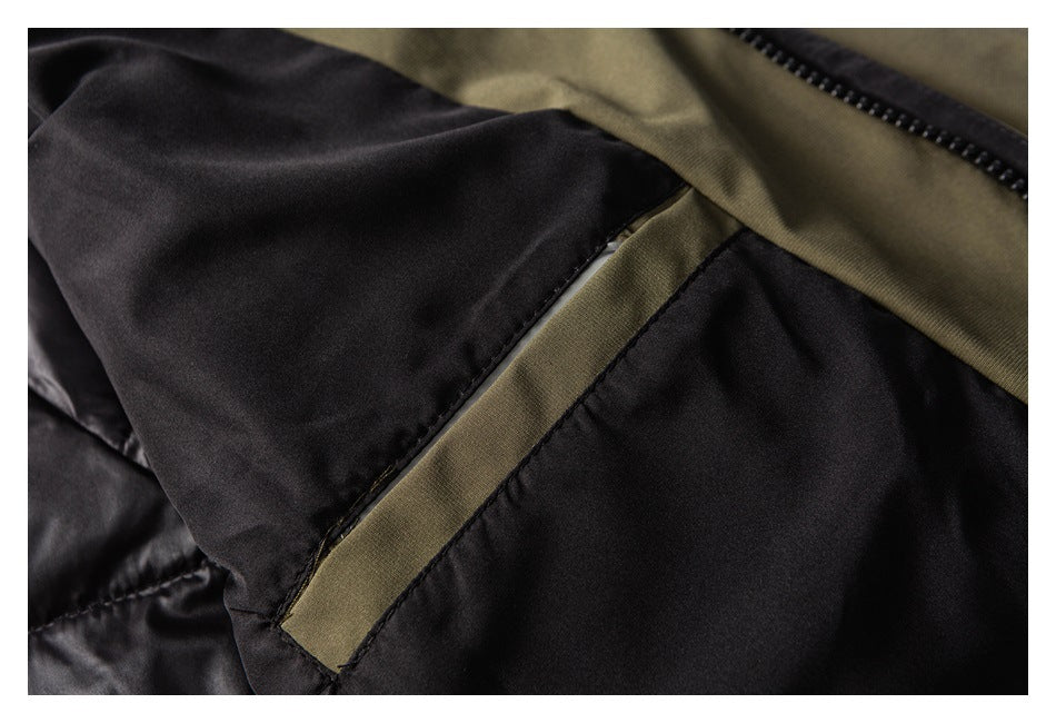 Close-up of the jacket's black lining and an olive fabric strip along a stitched seam.
