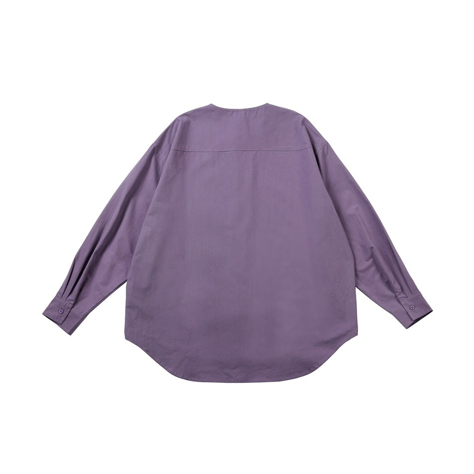 Back view of a muted purple long-sleeved shirt with a curved hem and a horizontal yoke seam.