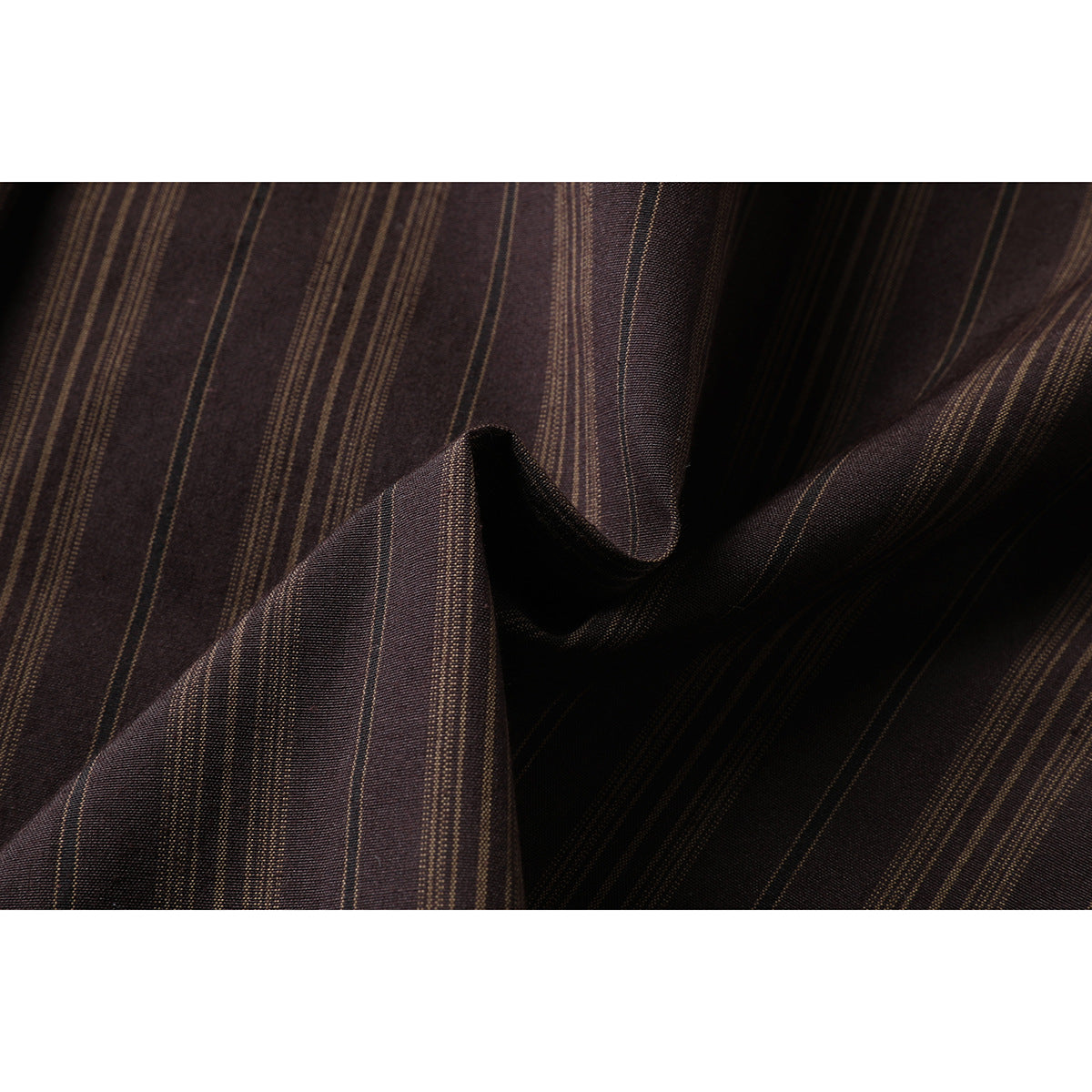Close-up of dark brown fabric with narrow tan stripes, shown folded to reveal its drape and texture.