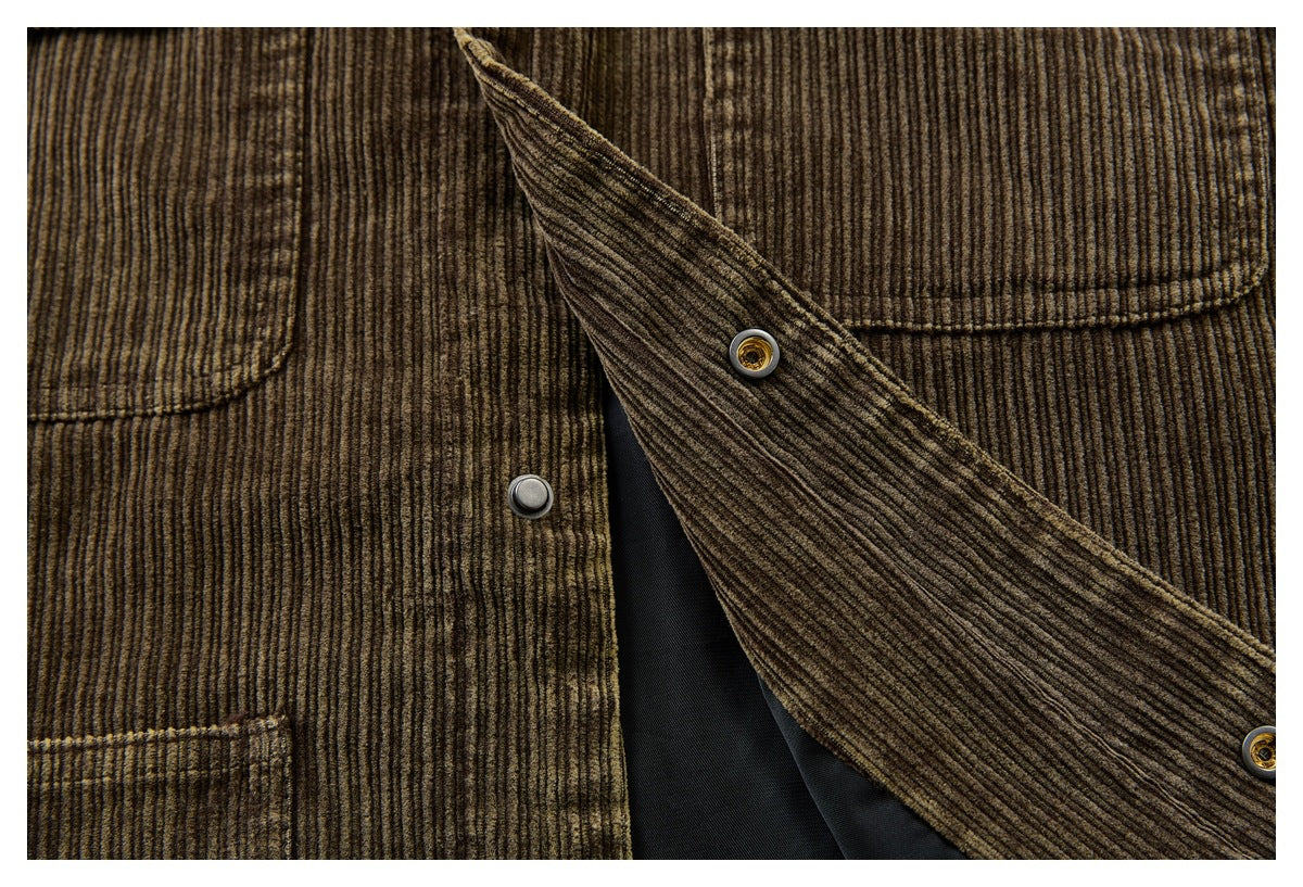 Close-up of the brown corduroy jacket’s open snap front, showing the dark lining.
