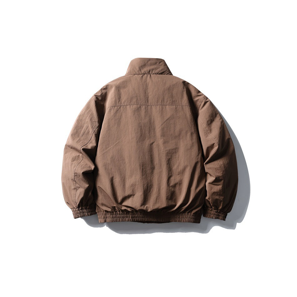 Back view of a brown jacket with a stand collar, long sleeves, and elastic cuffs and hem.