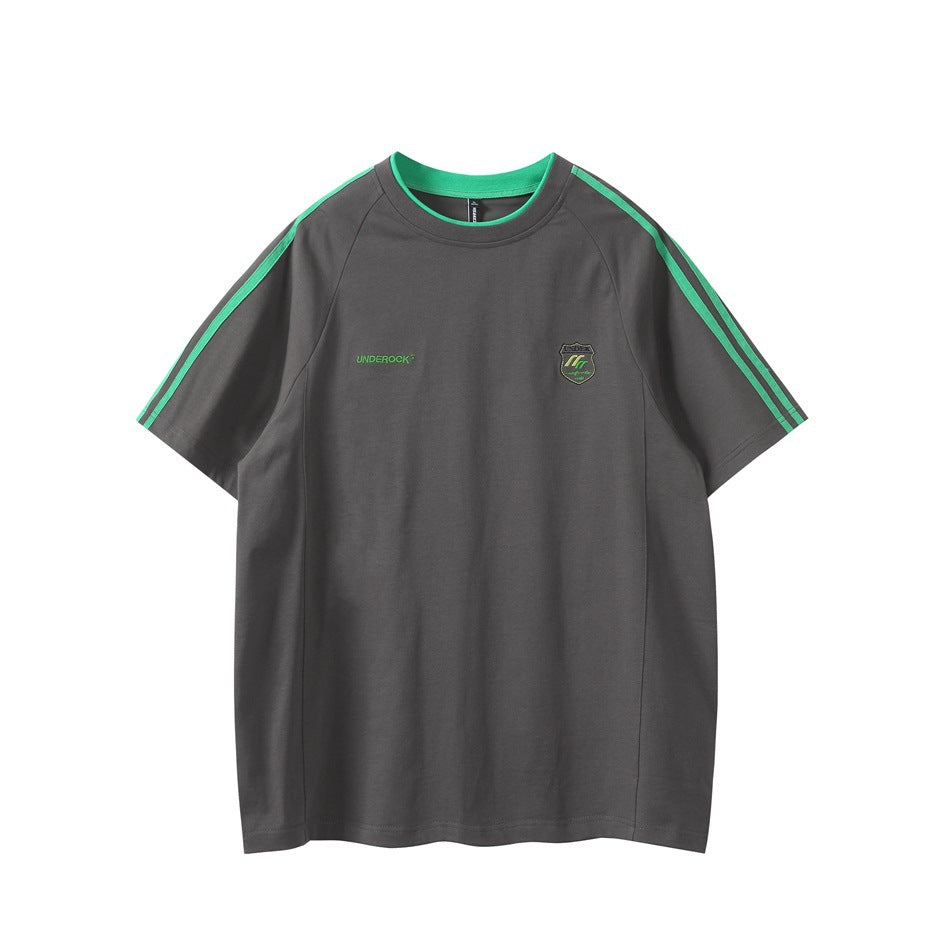 Dark gray raglan T-shirt with green collar trim, green shoulder stripes and embroidered chest crest, front view