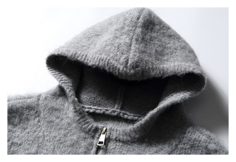 Close-up of the gray sweater's hood opening, knit edge, and zipper pull.